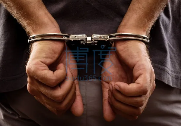 depositphotos_28109403-stock-photo-arrested-man-handcuffed-hands-at.jpg