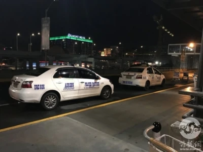 菲律宾机场警察逮捕专宰旅客的白色出租车司机